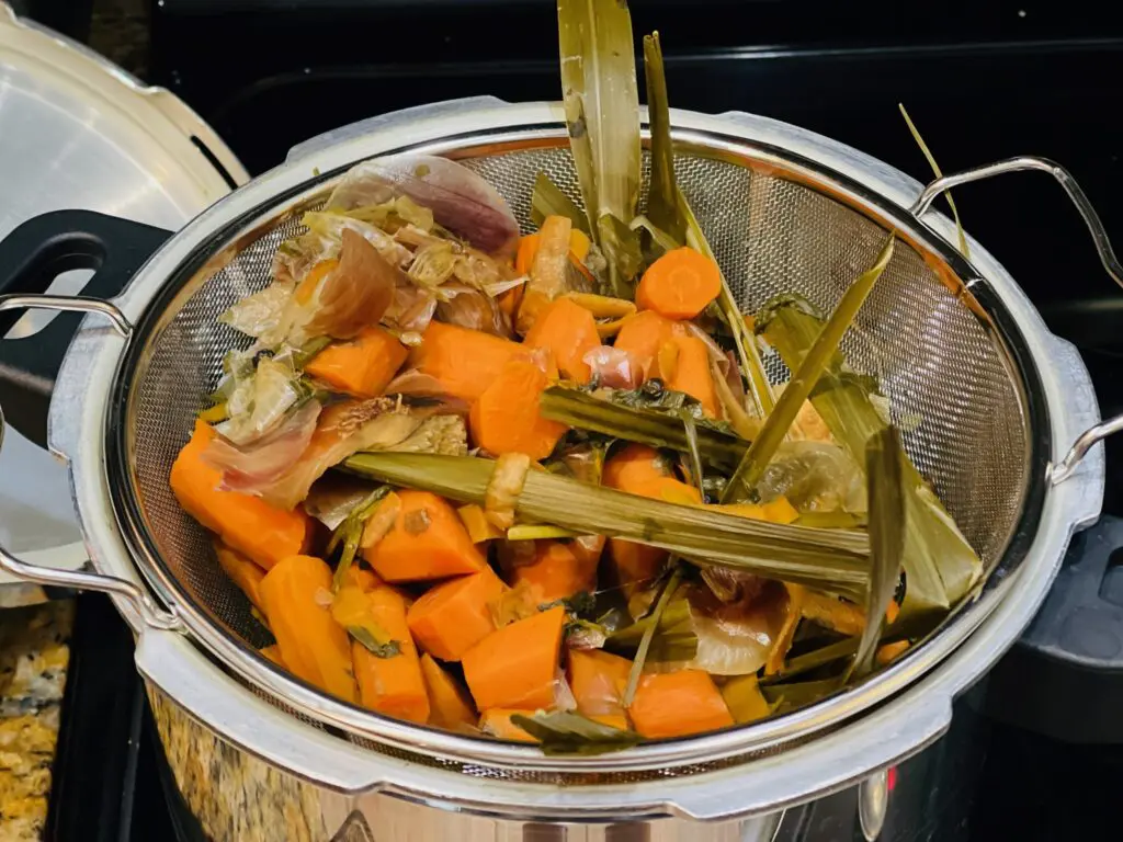 straining vegetable scraps - Domestic Gourmet