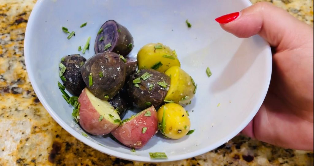 Small gourmet rosemary and sea salt potatoes coated in olive oil, substitute the olive oil with Domestic Gourmet Organic Annatto Oil - Aceite de Achiote for richer color and flavor