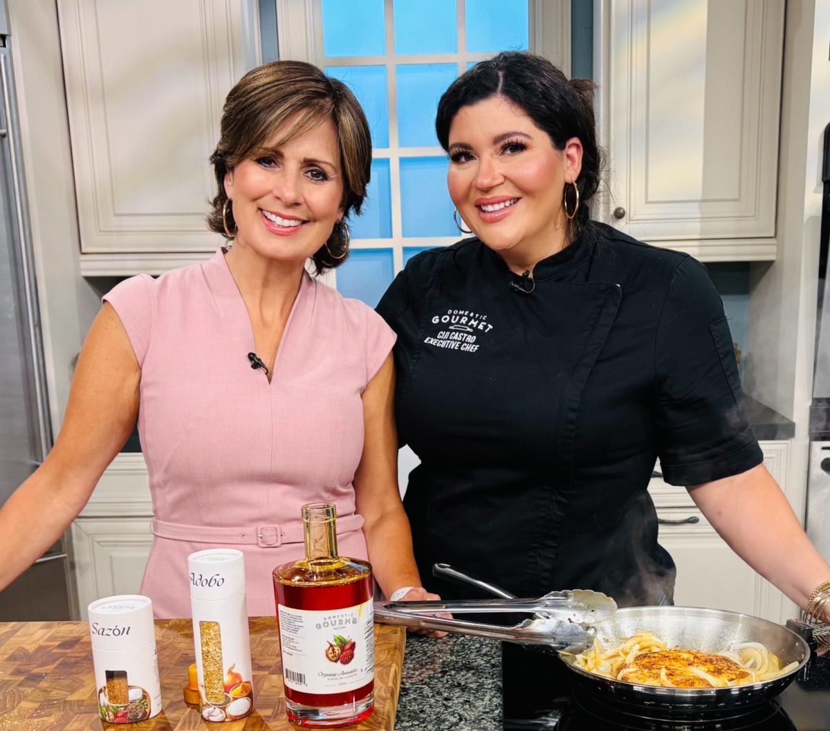 Chef Ciji Castro and WFLA's Daytime TV Host Maggie Rodriguez making Mimis Chicken - Pollo Encebollado made with Domestic Gourmet Annatto Oil, Sazón and Adobo